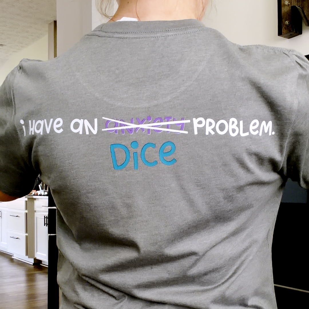 Person wearing a gray t-shirt with text on the back 