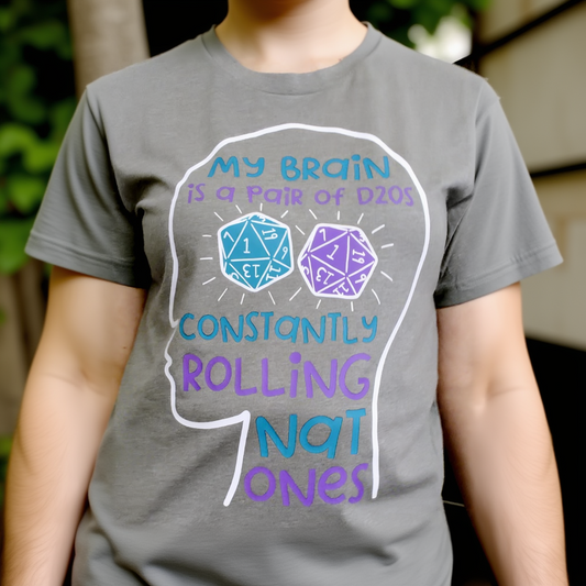 Gray t-shirt with dice graphic and text on a person wearing it.